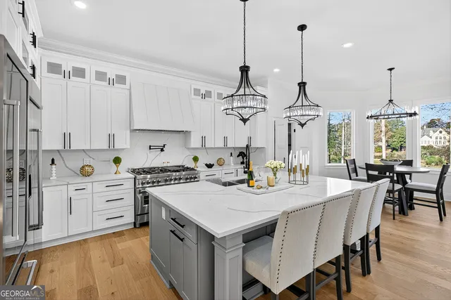 a bathroom with a sink a toilet and a shower