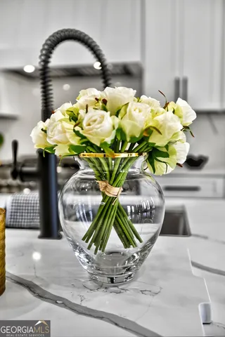 an empty room with a window and a ceiling fan view
