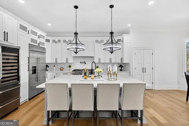 a bathroom with a granite countertop sink vanity and mirror