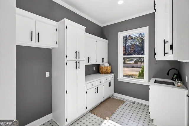 a living room with furniture floor to ceiling window and a floor to ceiling window