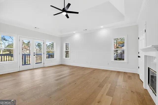 a yellow house with trees in front of it