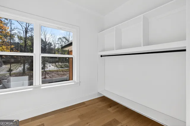 a view of a wooden deck with a yard