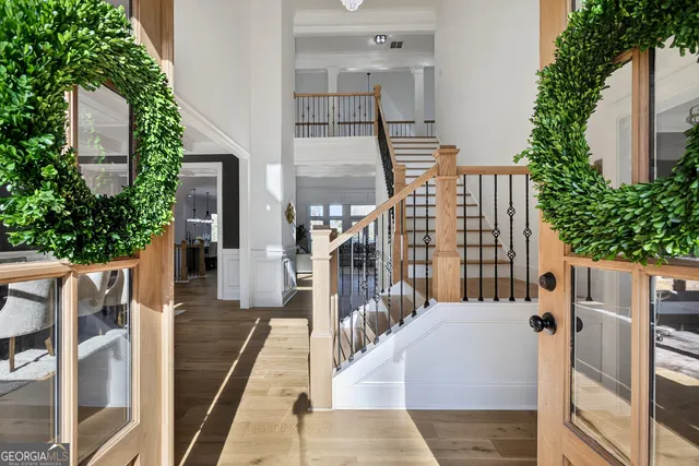 a view of a yard with wooden fence