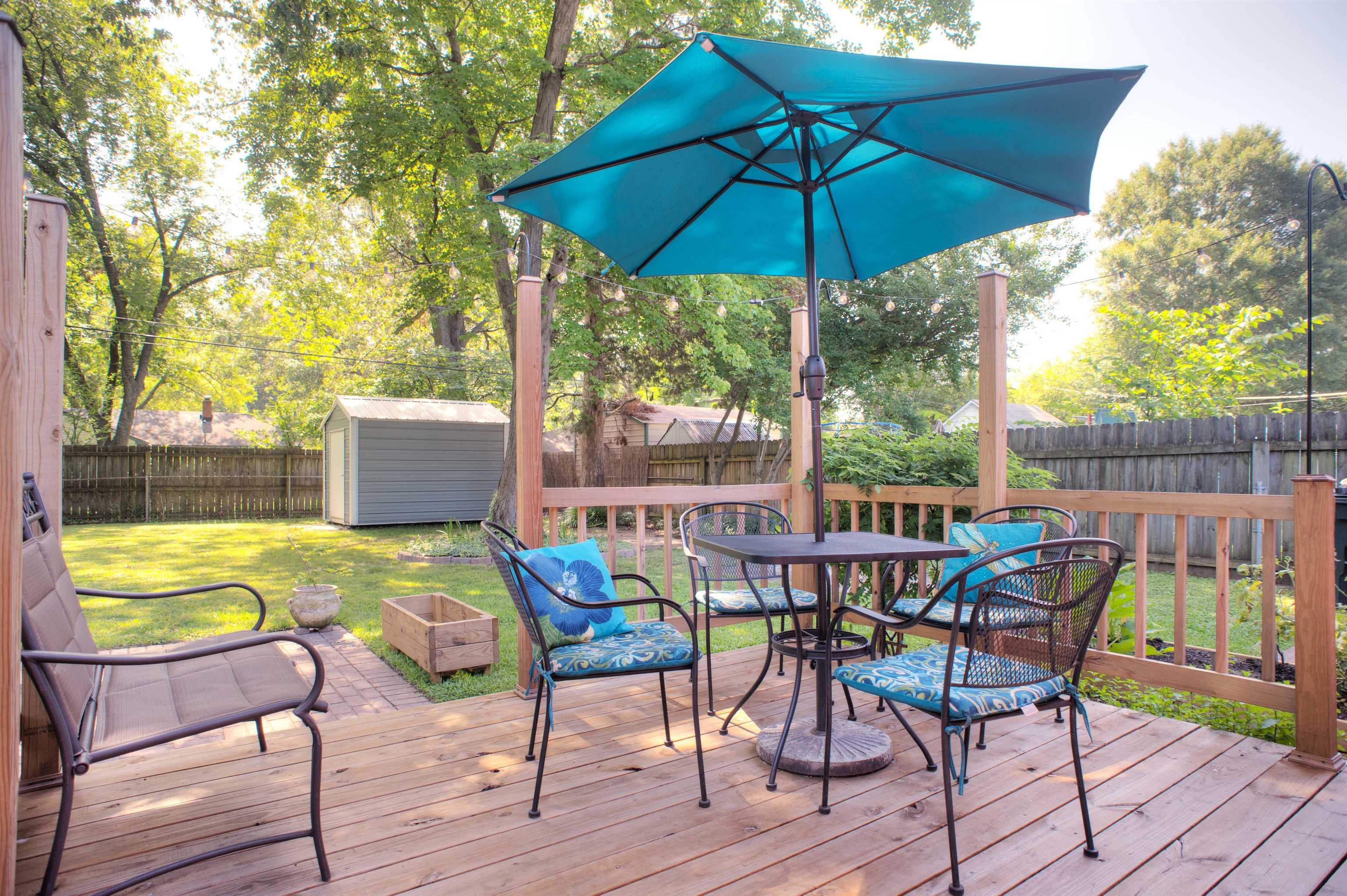 1612 Raymore Road Memphis, TN 38117 - Photo 13 of 17 a view of an outdoor sitting area with furniture and umbrella