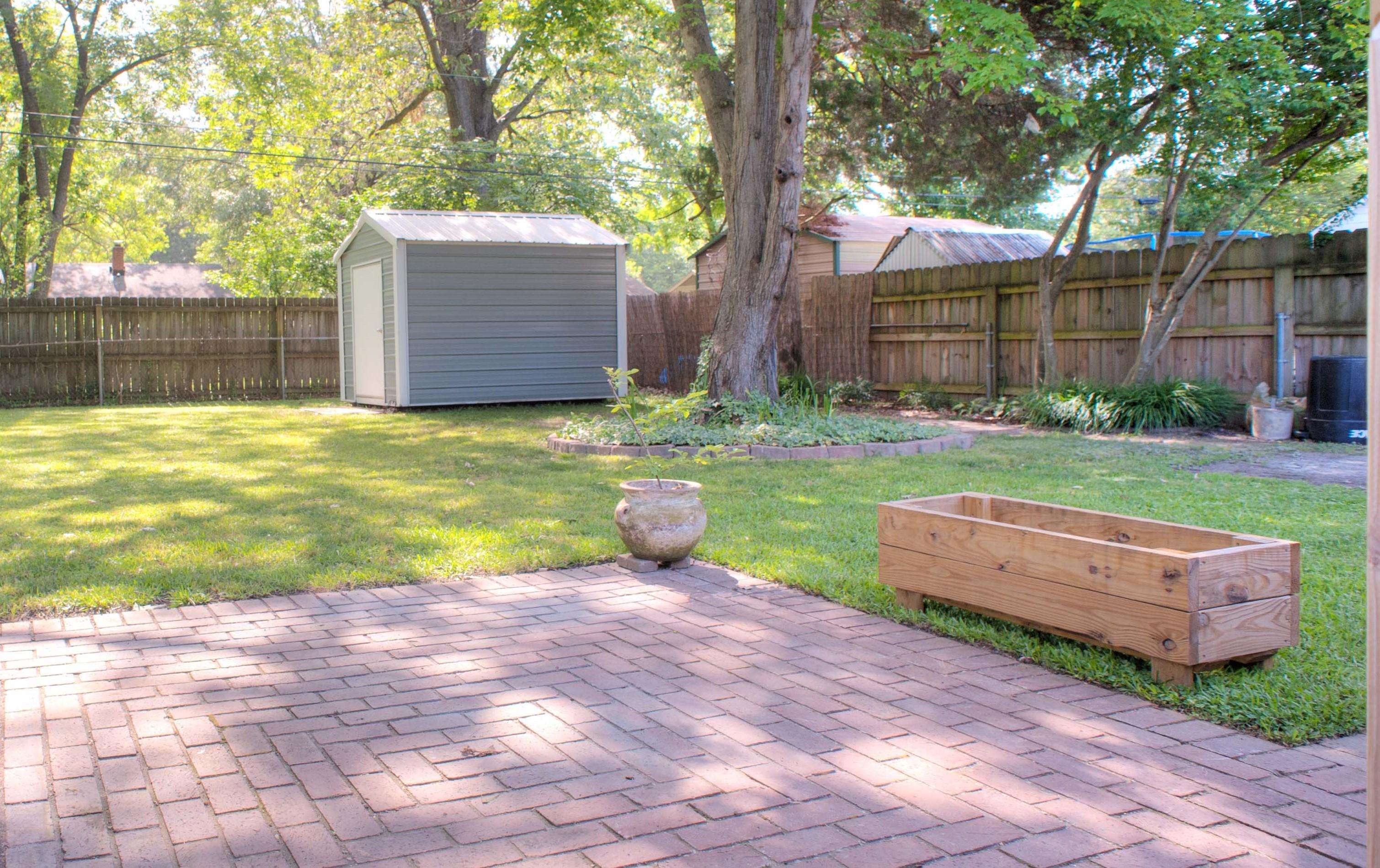 1612 Raymore Road Memphis, TN 38117 - Photo 14 of 17 a view of a backyard with a table and chair