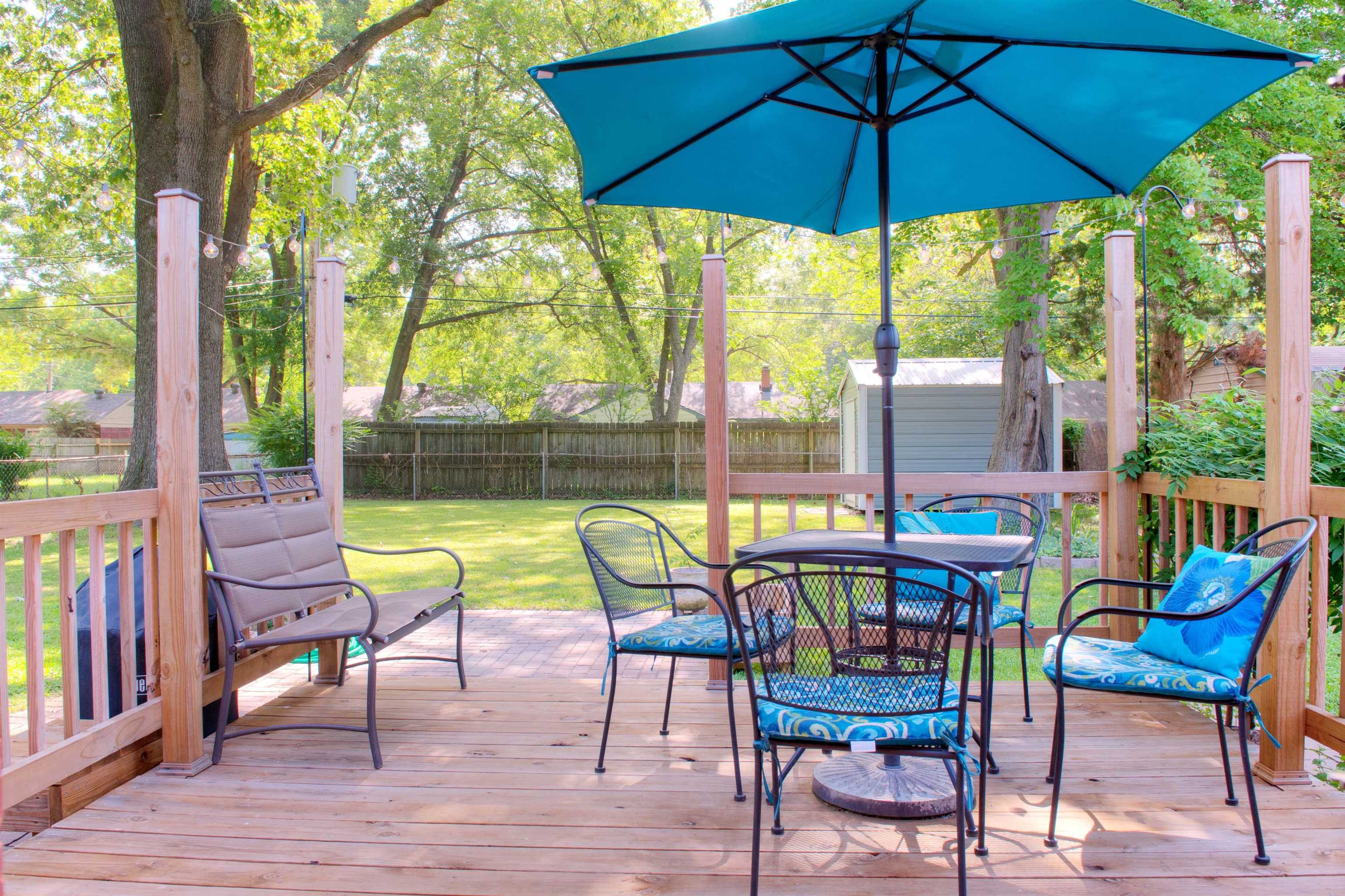1612 Raymore Road Memphis, TN 38117 - Photo 15 of 17 a view of a chairs and table in the patio next to a yard