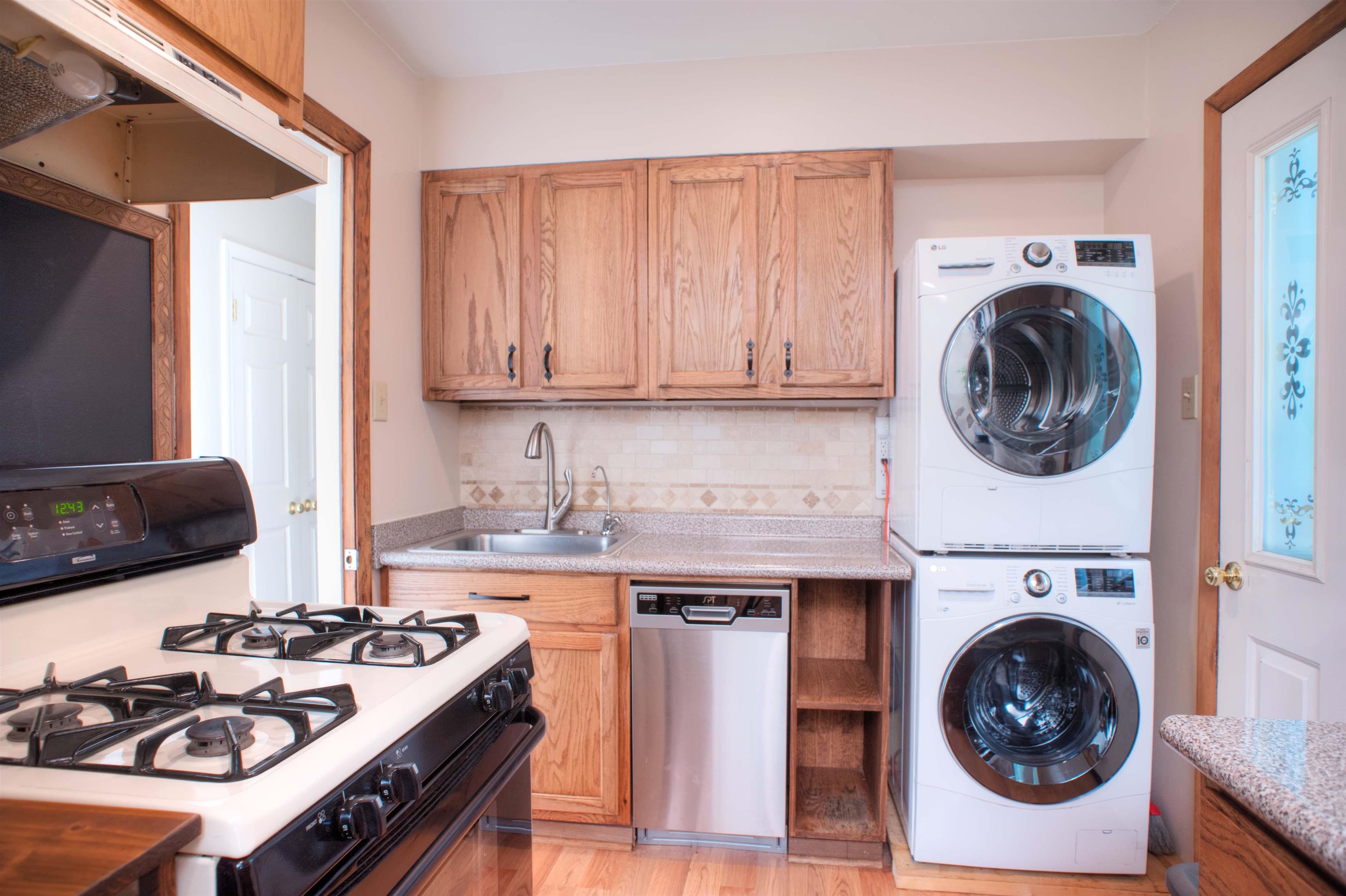 1612 Raymore Road Memphis, TN 38117 - Photo 4 of 17 a kitchen with a stove and a sink