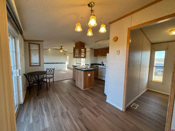 a view of an entryway with wooden floor