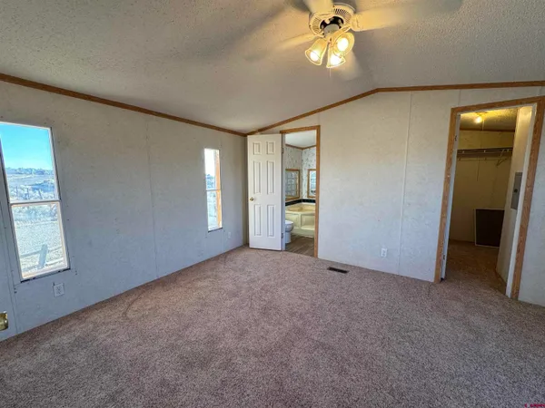a bathroom with a toilet a sink and a mirror