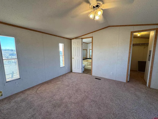a bathroom with a toilet a sink and a mirror