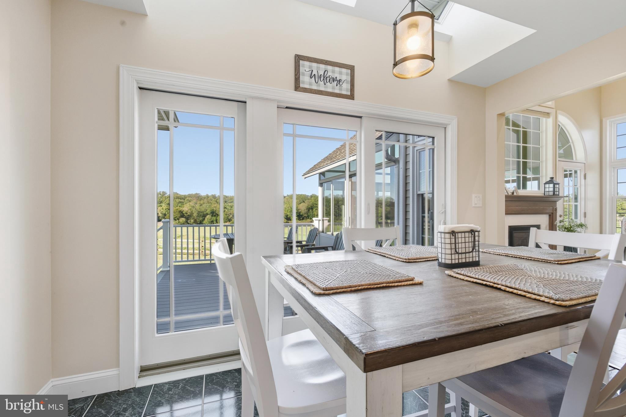 115 Scott Road Warwick, MD 21912 - Photo 14 of 32 a kitchen with a table chairs and window