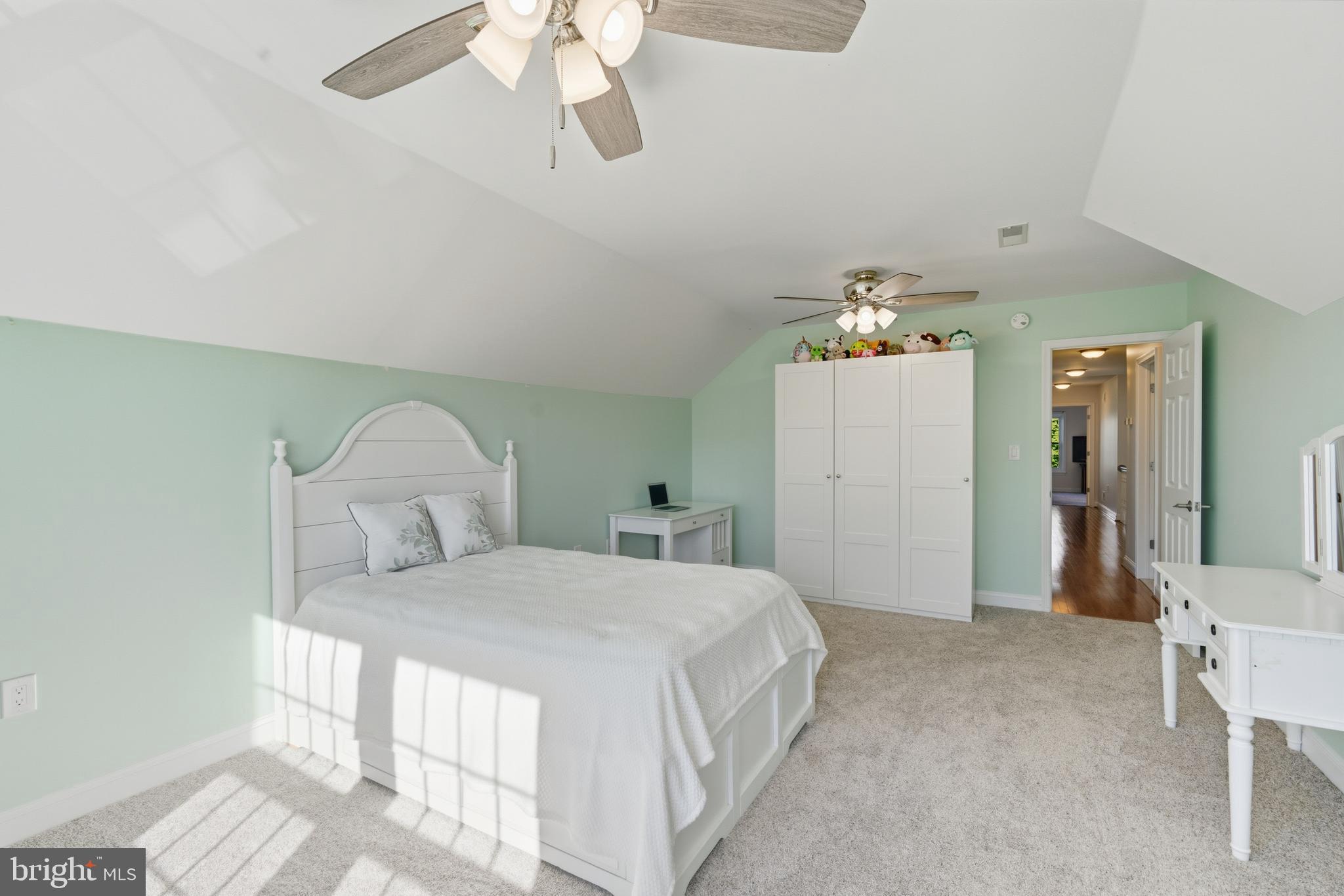 115 Scott Road Warwick, MD 21912 - Photo 20 of 32 a bedroom with a bed and a chandelier