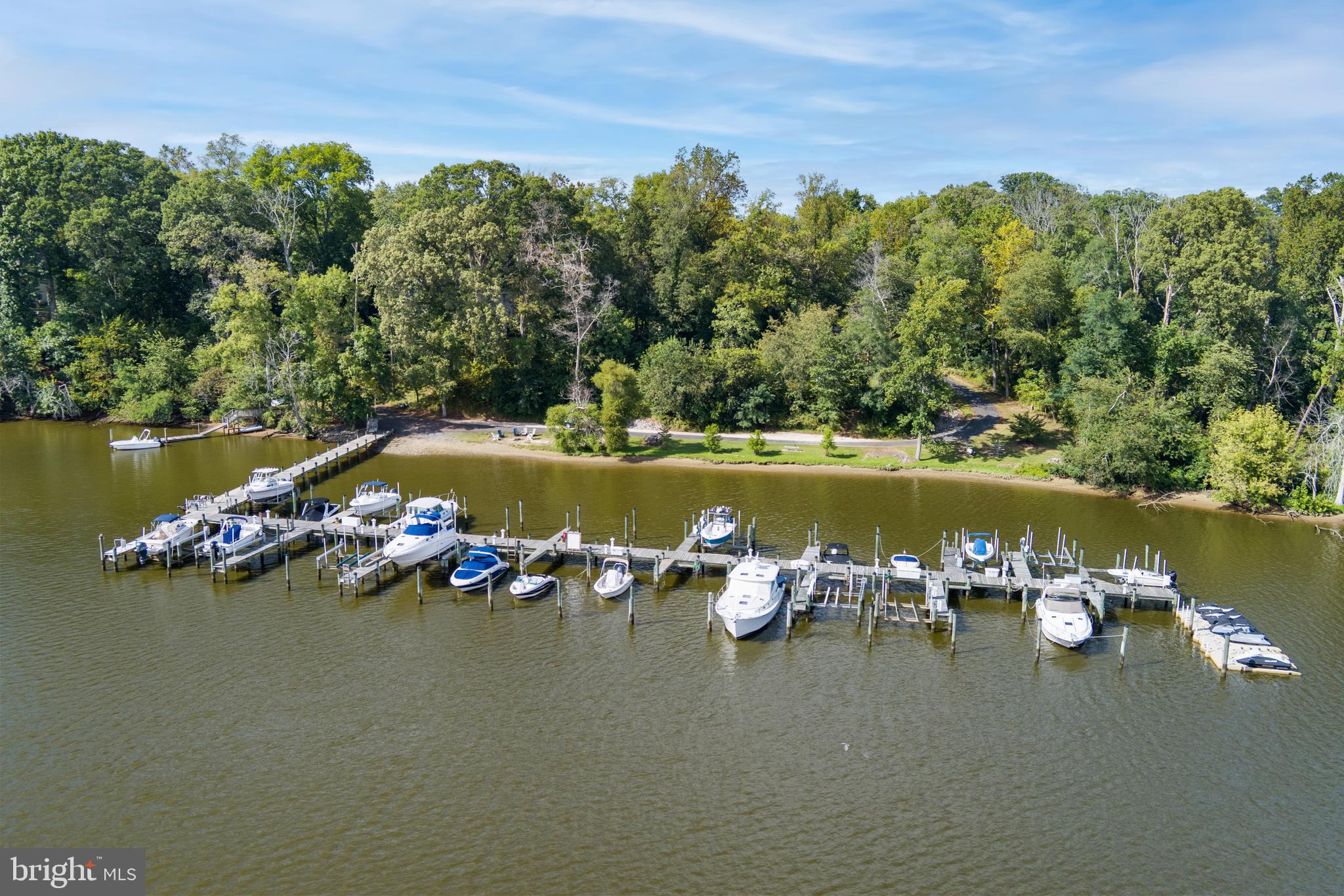 115 Scott Road Warwick, MD 21912 - Photo 6 of 32 a view of a lake with boats and trees in the background