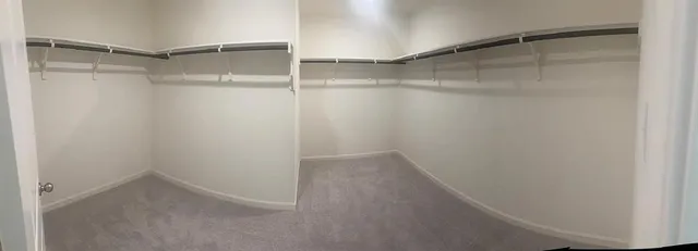 a view of an empty walk in closet