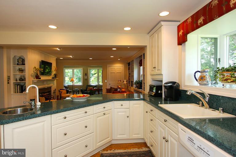 308 Golf Course Road Owings Mills, MD 21117 - Photo 6 of 30 Kitchen opens to Family Room with fireplace