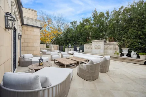 a view of a backyard with sitting area