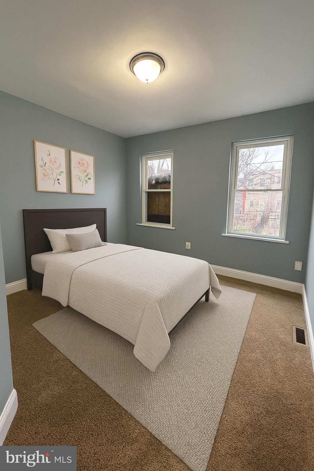 1930 Christian Street Baltimore, MD 21223 - Photo 12 of 20 a bedroom with a bed and a night stand