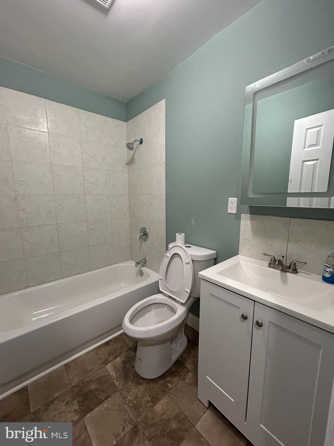 1930 Christian Street Baltimore, MD 21223 - Photo 15 of 20 a bathroom with a sink toilet a mirror and shower