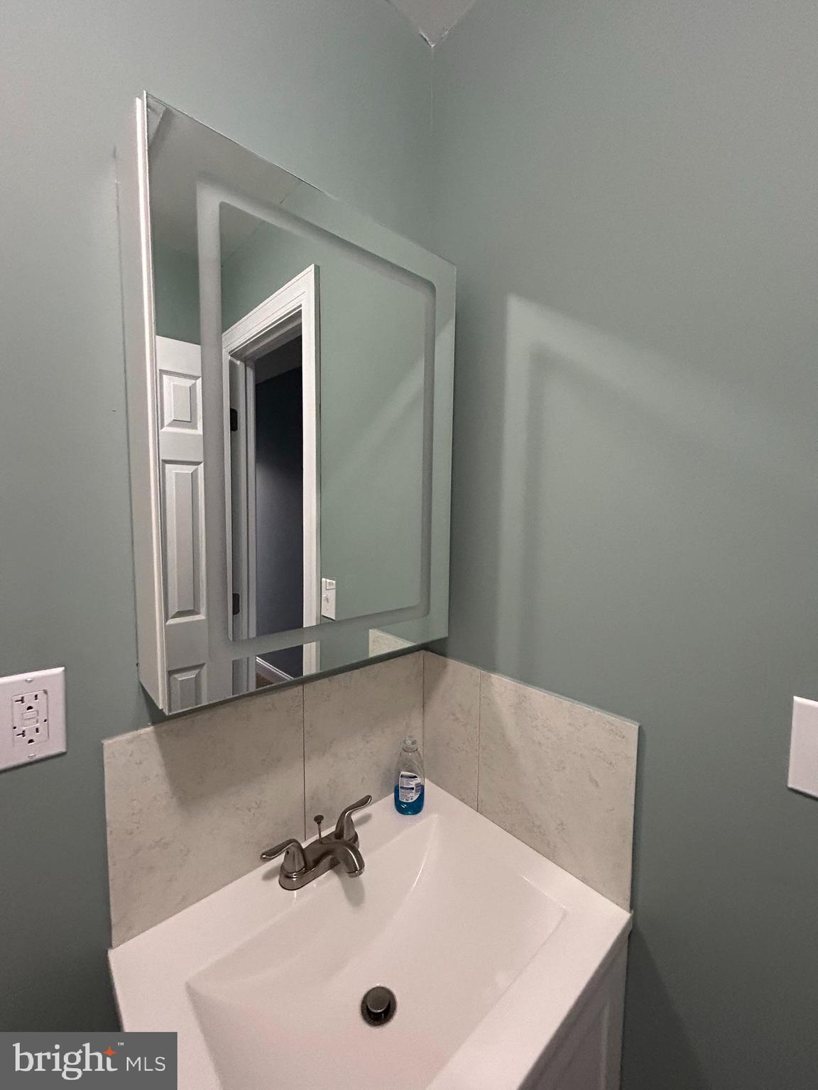 1930 Christian Street Baltimore, MD 21223 - Photo 17 of 20 a bathroom with a sink and a mirror