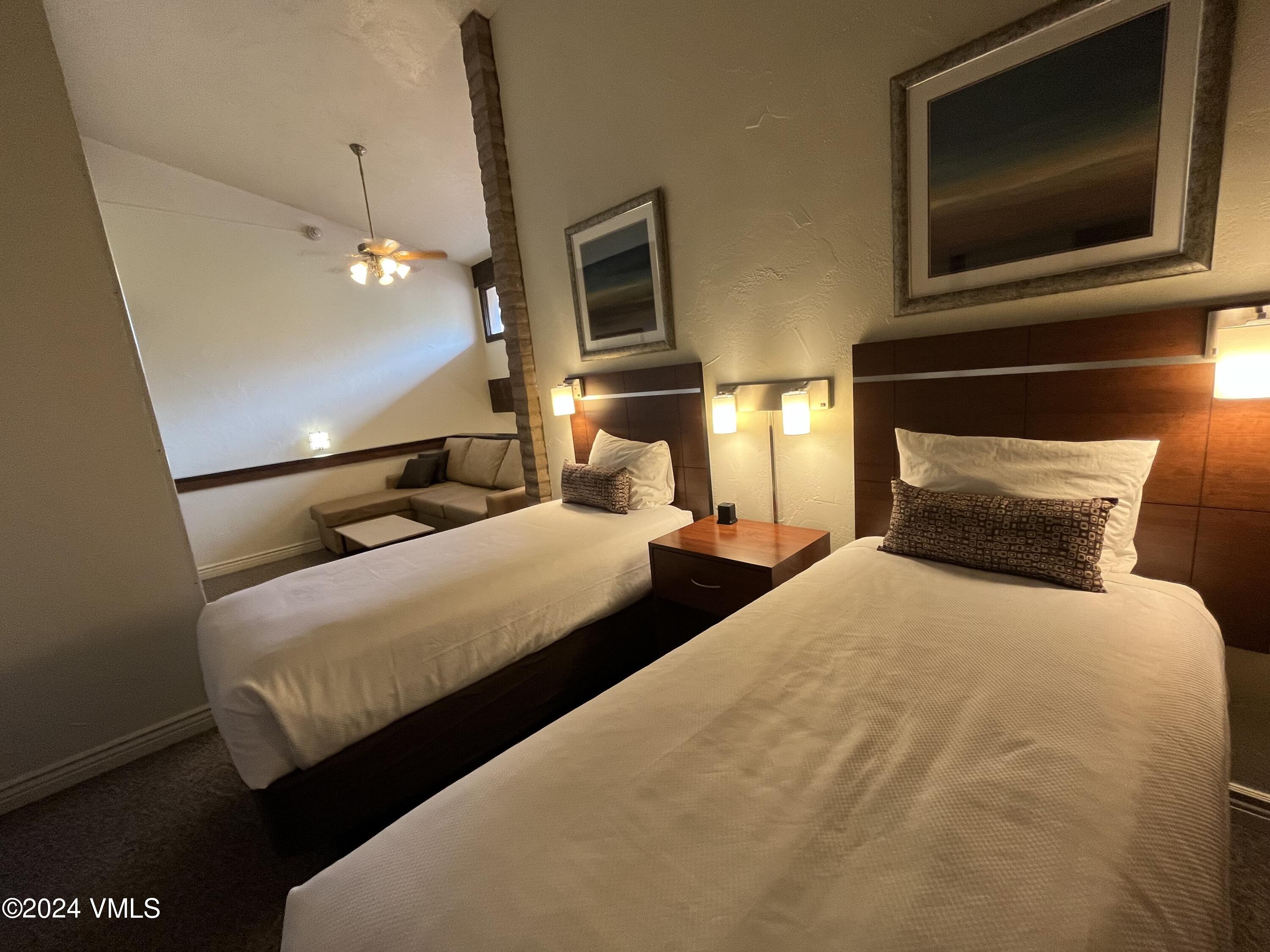 1020 Vail View Drive, Unit 340222 Vail, CO 81657 - Photo 15 of 32 a bedroom with bed tv and window