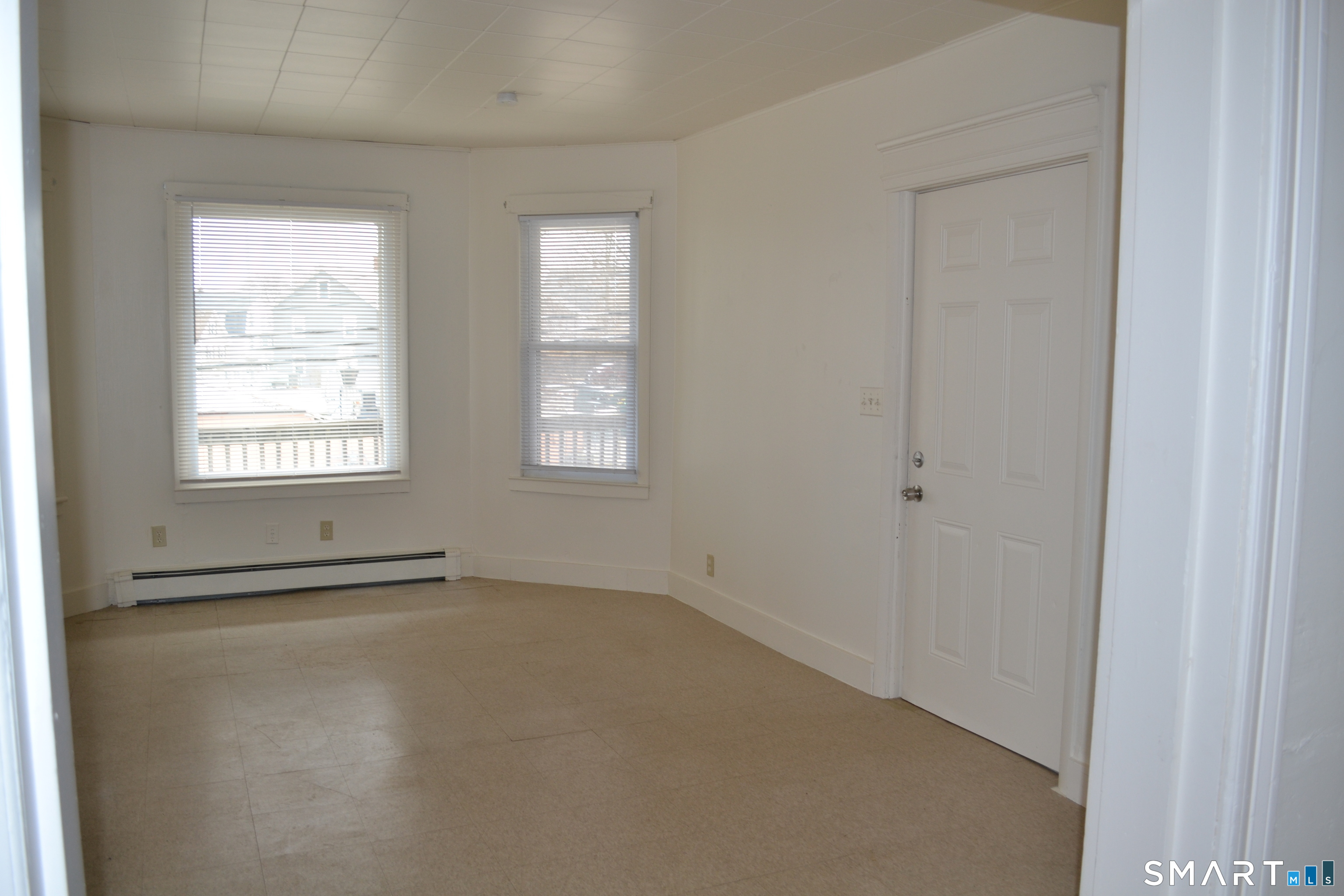 835 Bank Street New London, CT 06320 - Photo 2 of 13 an empty room with windows