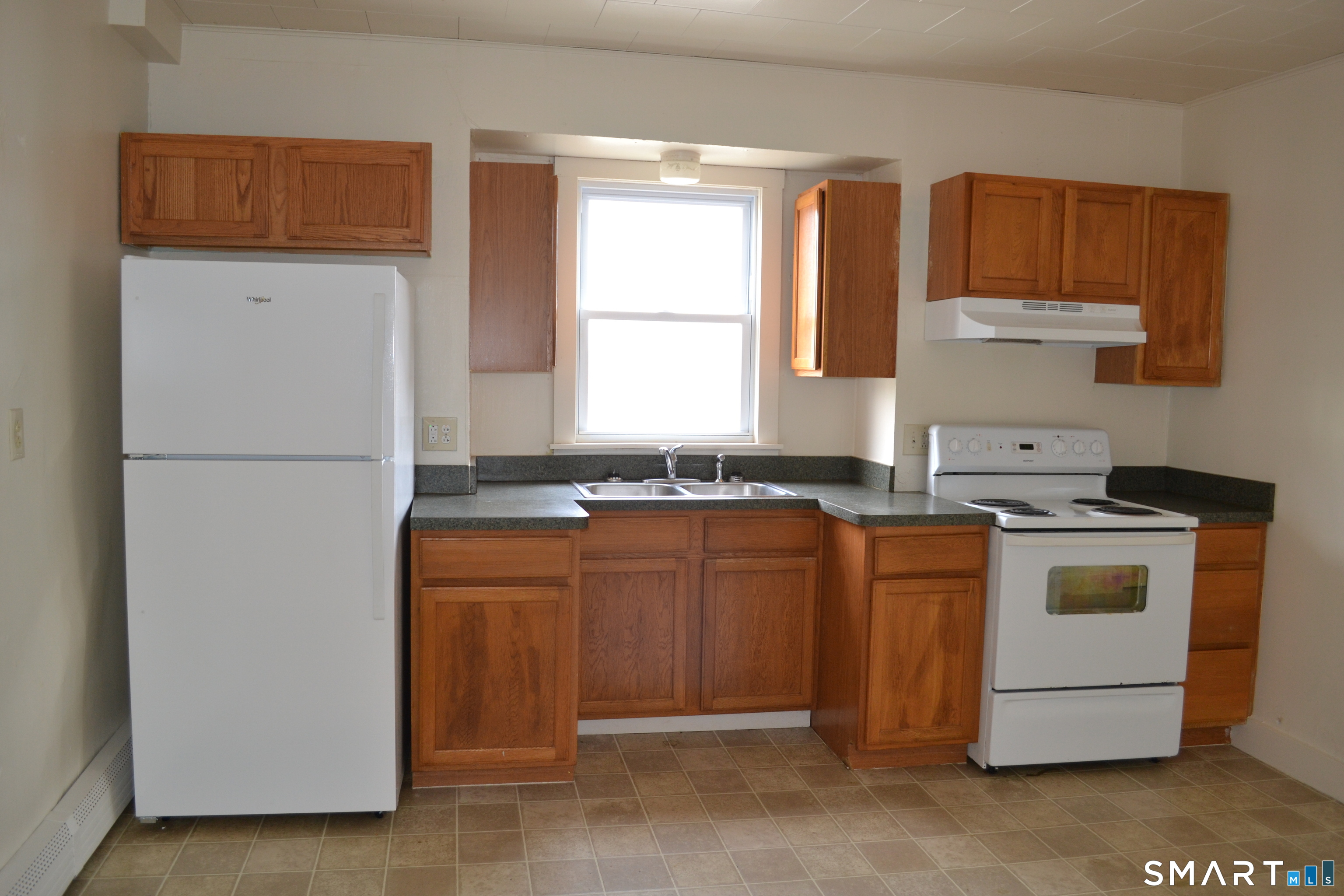 835 Bank Street New London, CT 06320 - Photo 4 of 13 a kitchen with stainless steel appliances granite countertop a refrigerator and a stove