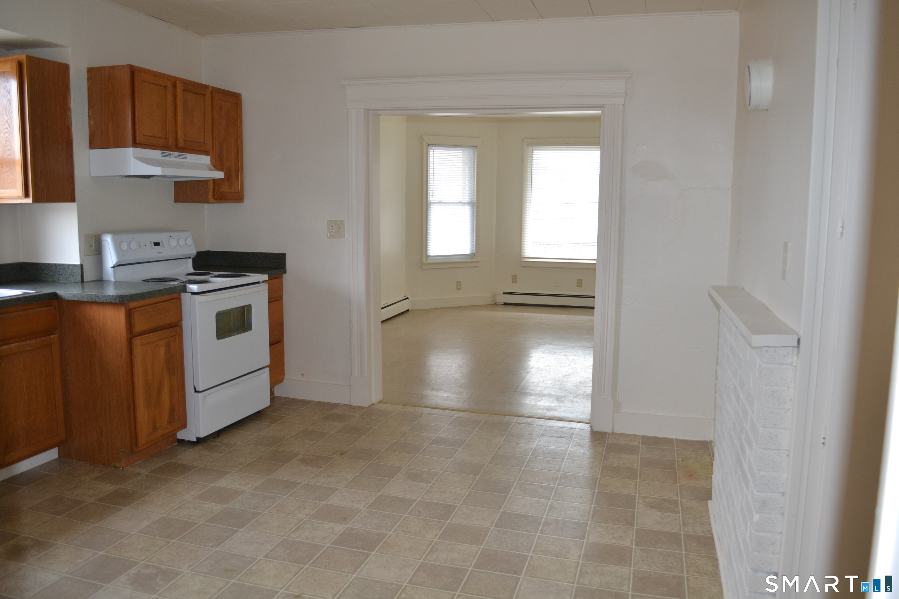 835 Bank Street New London, CT 06320 - Photo 5 of 13 a kitchen with a stove and a refrigerator