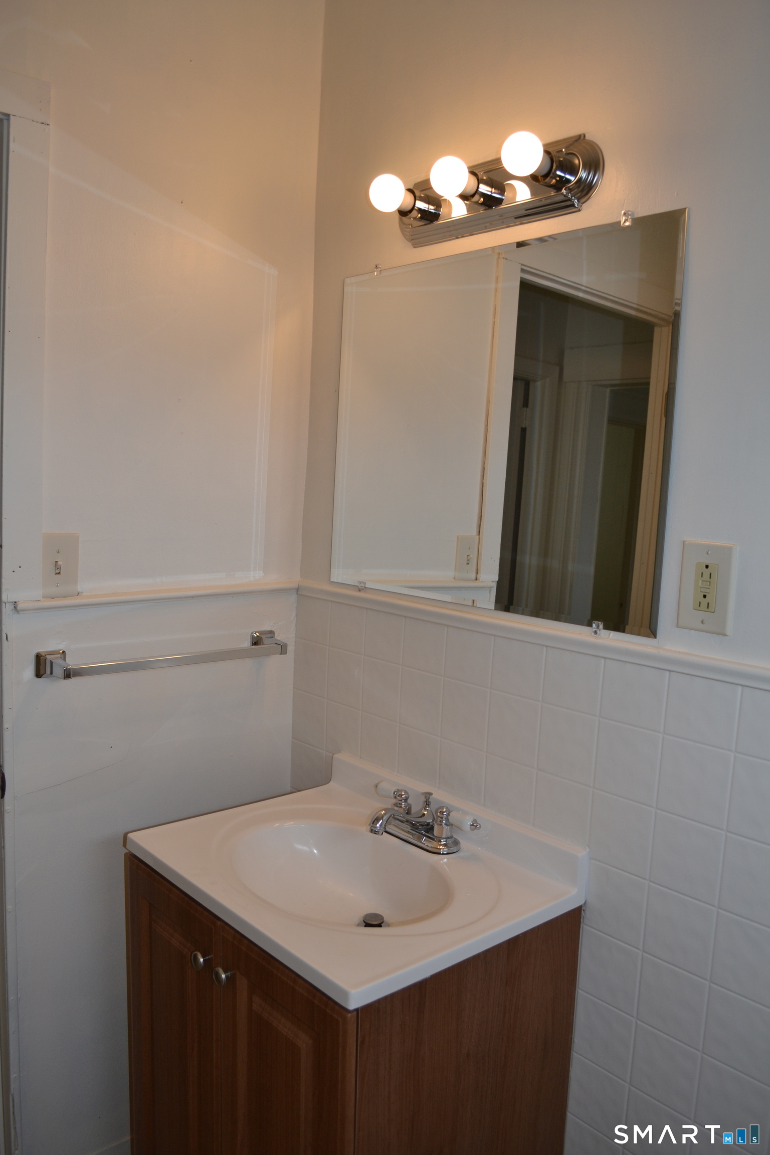 835 Bank Street New London, CT 06320 - Photo 7 of 13 a bathroom with a sink and a mirror