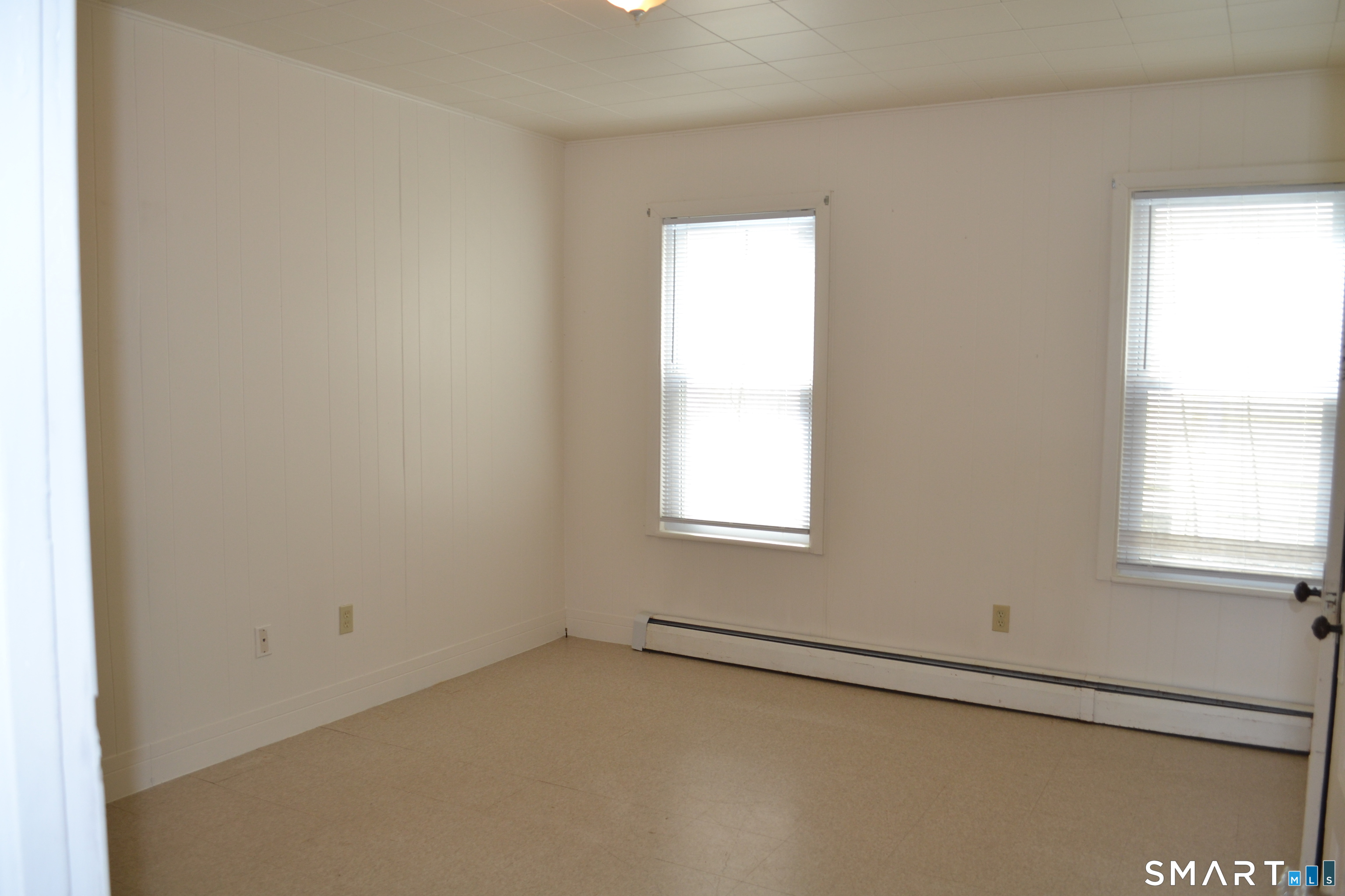 835 Bank Street New London, CT 06320 - Photo 9 of 13 an empty room with a window