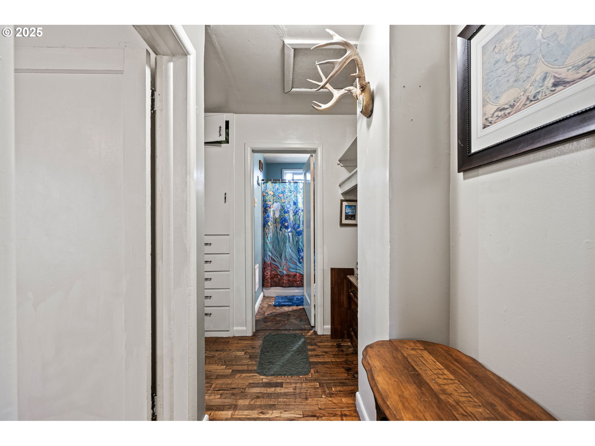 1425 East Madison Avenue Cottage Grove, OR 97424 - Photo 16 of 39 a view of a hallway with a wooden door