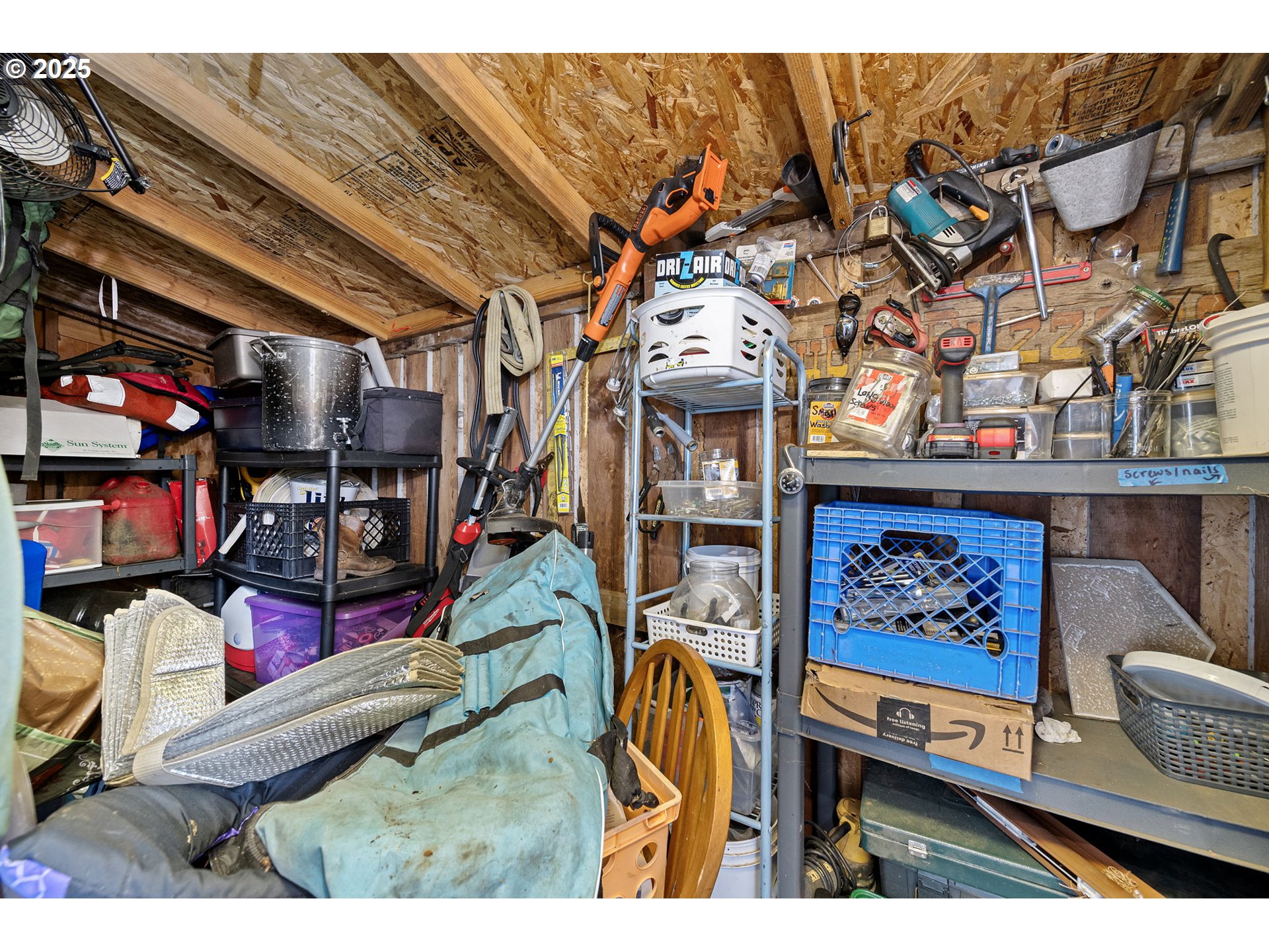 1425 East Madison Avenue Cottage Grove, OR 97424 - Photo 28 of 39 a view of gym equipment with racks on the wall
