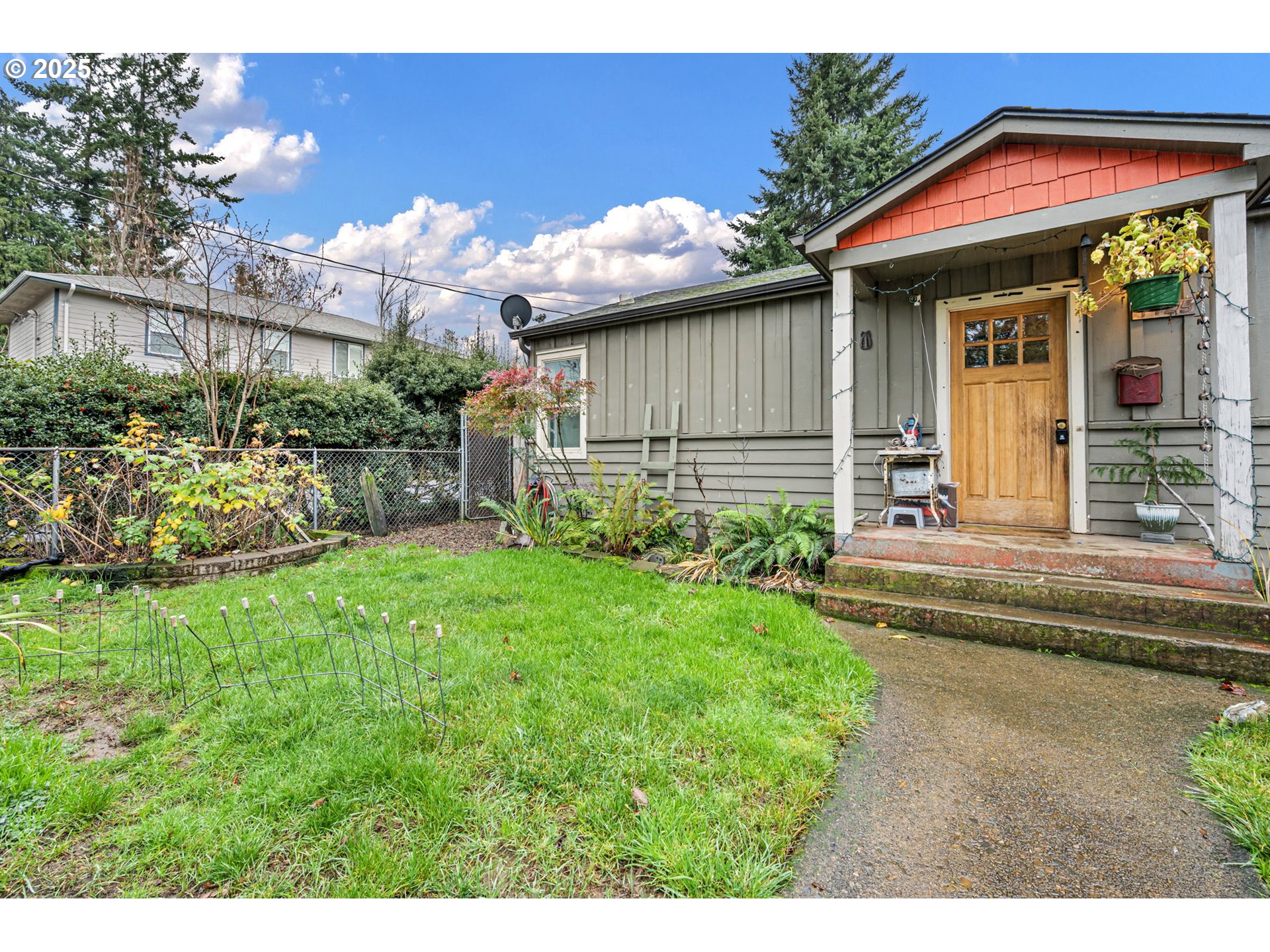 1425 East Madison Avenue Cottage Grove, OR 97424 - Photo 29 of 39 a view of a house with a yard and sitting area