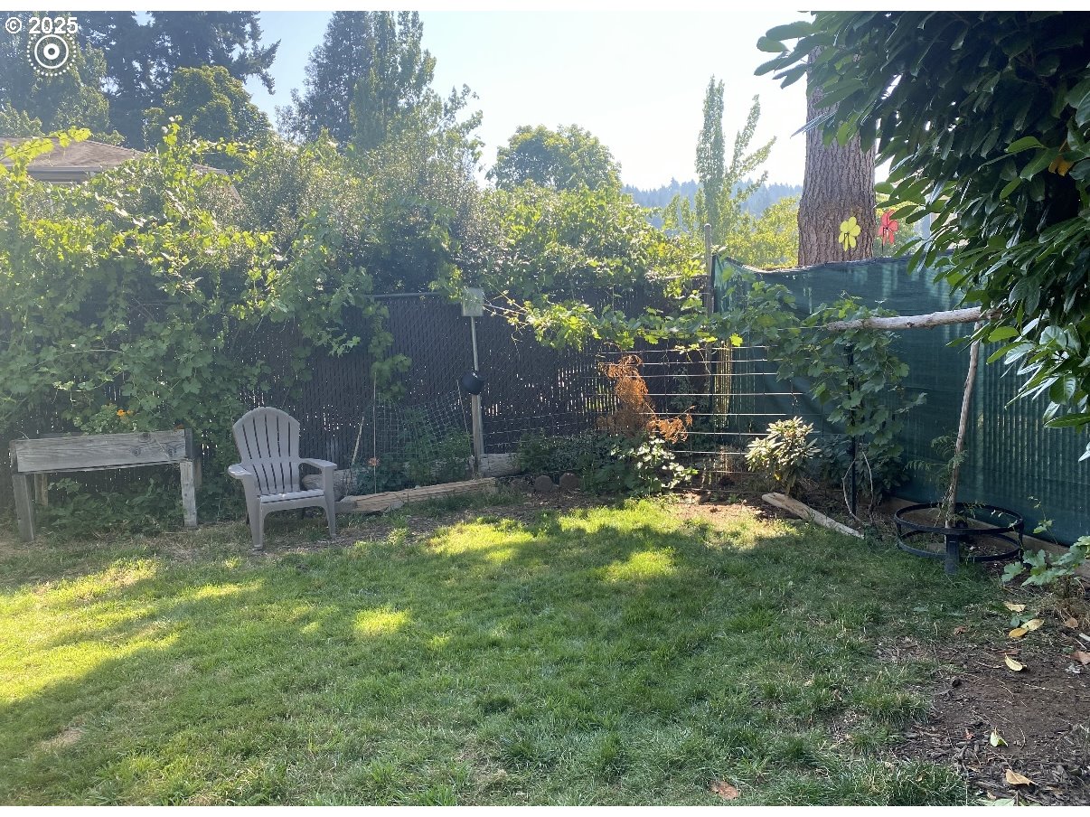 1425 East Madison Avenue Cottage Grove, OR 97424 - Photo 34 of 39 a backyard of a house with table and chairs