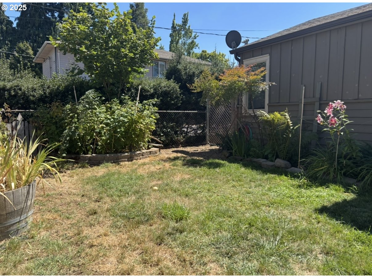1425 East Madison Avenue Cottage Grove, OR 97424 - Photo 38 of 39 a view of a house with a yard