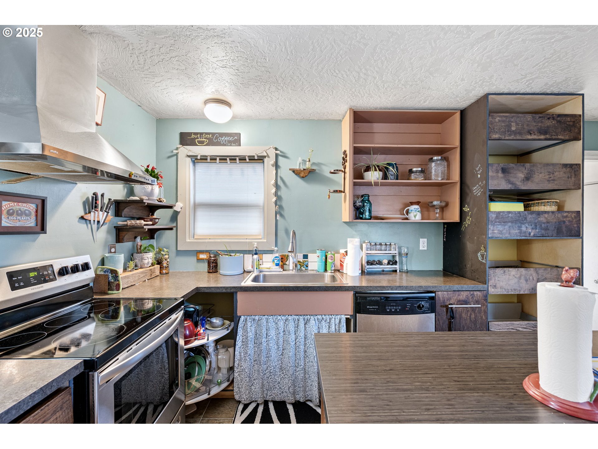 1425 East Madison Avenue Cottage Grove, OR 97424 - Photo 10 of 39 a kitchen with stainless steel appliances granite countertop a stove and cabinets