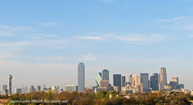 a view of a city with tall buildings in the background