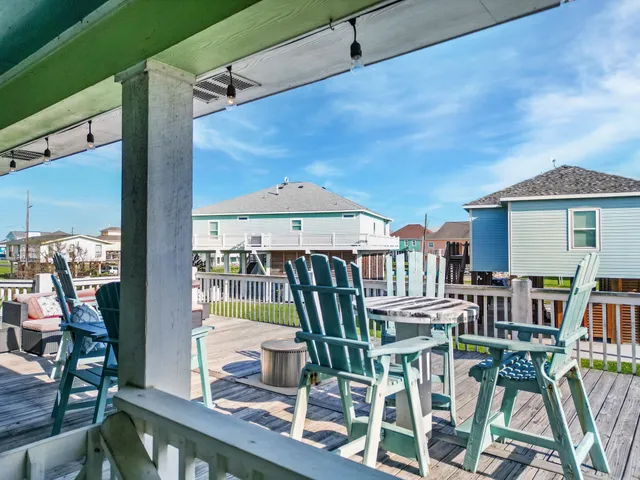 a view of a patio with table and chairs