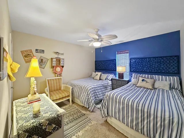 a bedroom with double bed and a chandelier