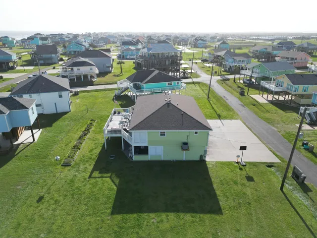 an aerial view of a house with a garden
