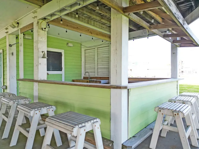 a balcony with a table and chairs