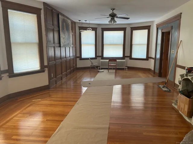a view of a living room and kitchen with a large window