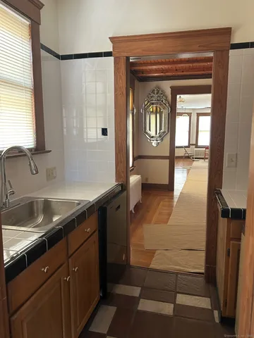 a bathroom with a sink a mirror and a shower