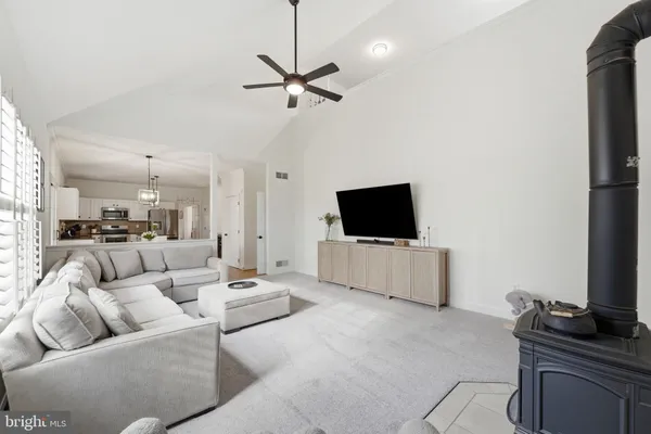 a view of a livingroom with furniture and a workspace