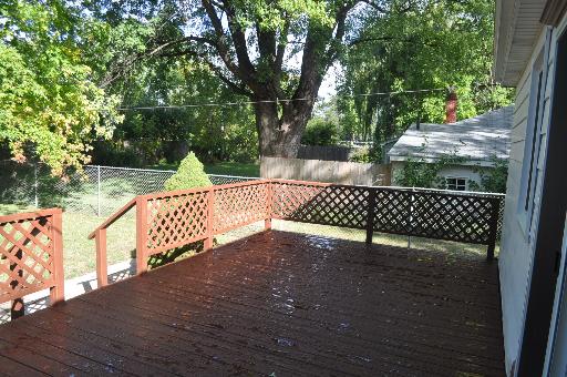 110 South Lyle Avenue Elgin, IL 60123 - Photo 12 of 13 a view of a wooden deck with a bench