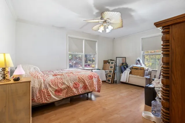 a bedroom with bed and window
