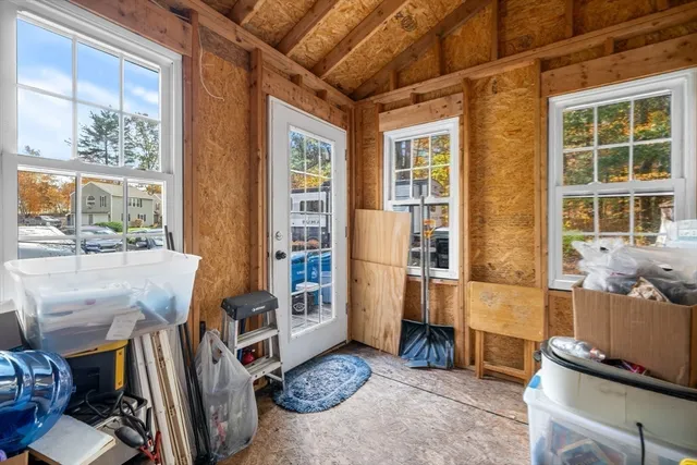 a living room with furniture windows and a table