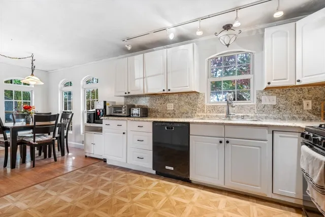 a kitchen with a cabinets and window