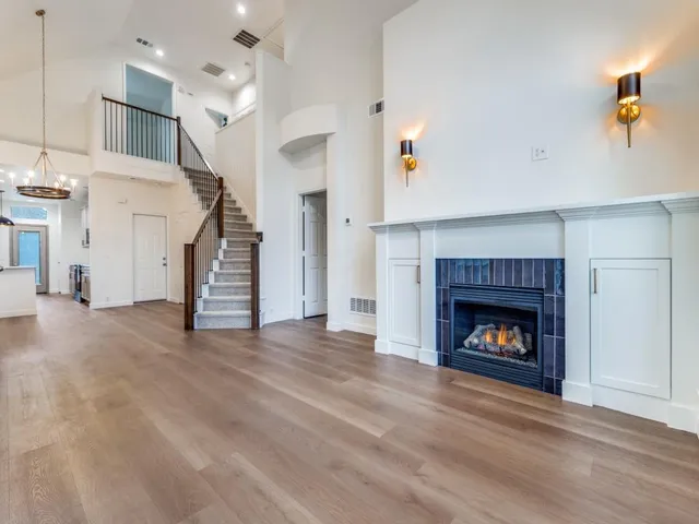 a view of empty room with a fireplace