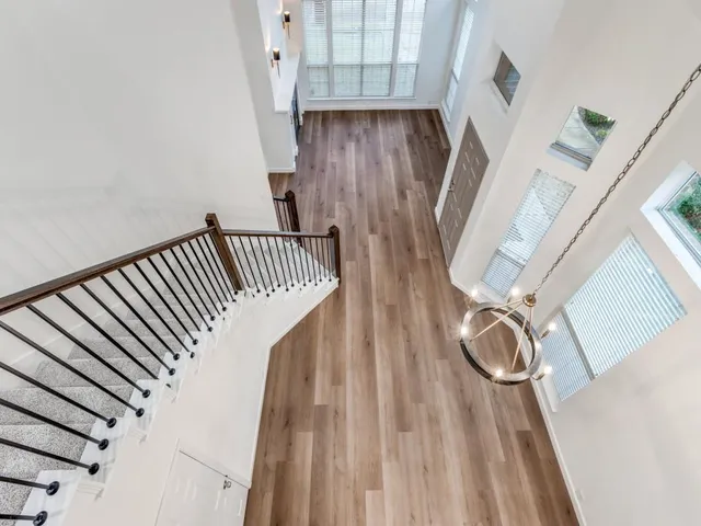 a view of stairs with wooden floor