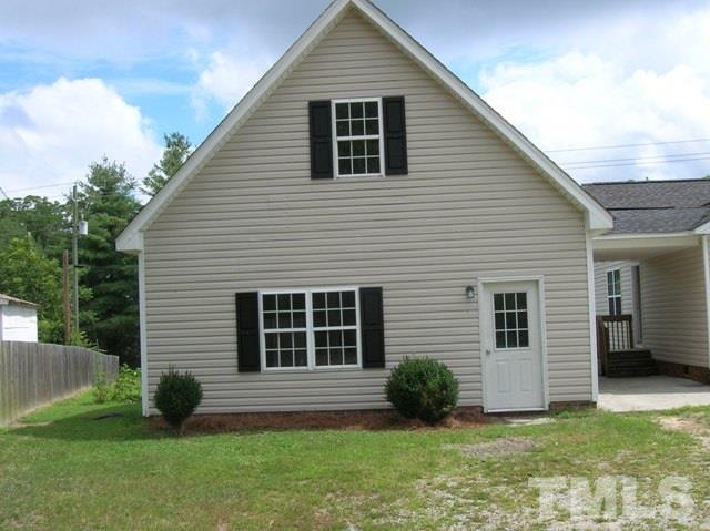 2695 Highway 42 Willow Spring, NC 27592 - Photo 2 of 22 a view of backyard with a garden and entertaining space